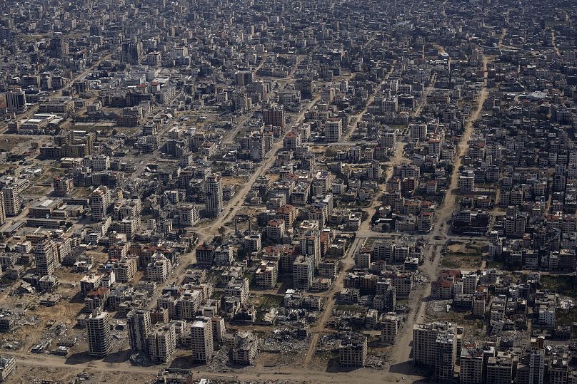 Destroyed buildings seen from a US Air Force plane flying over the Gaza Strip, 14 March, 2024