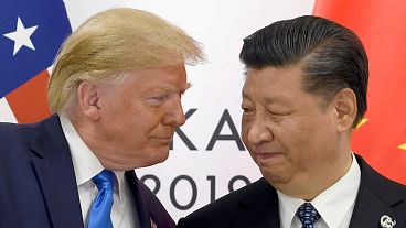 FILE - In this Saturday, June 29, 2019, file photo, U.S. President Donald Trump, left, meets with Chinese President Xi Jinping during a meeting on the sidelines of the G-20