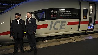 Employees stand by the first Paris-Berlin high speed train line that will operate Monday, Dec. 16, 2024 at the Gare de l'Est station in Paris. (AP Photo/Aurelien Morissard)