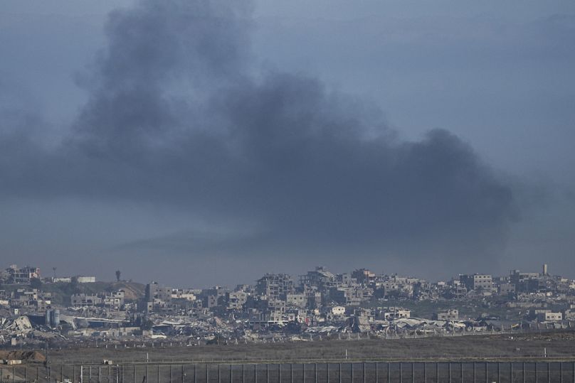 Smoke rises following an Israeli airstrike in the Gaza Strip, as seen from southern Israel on Sunday, Jan. 19, 2025. (AP Photo/Tsafrir Abayov)