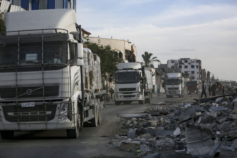 Humanitarian aid trucks enter through the Kerem Shalom crossing from Egypt into the Gaza Strip, Jan 19 2025