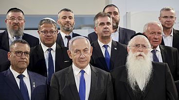 FILE - Israeli Prime Minister Benjamin Netanyahu with Israel's Minister of Jerusalem Affairs and Heritage Meir Porush, right, and other members the cabinet, June 5, 2024