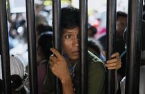 People displaced by the violence line up to register for shelter at a stadium in Cúcuta, Colombia, on 19 January, 2025. 