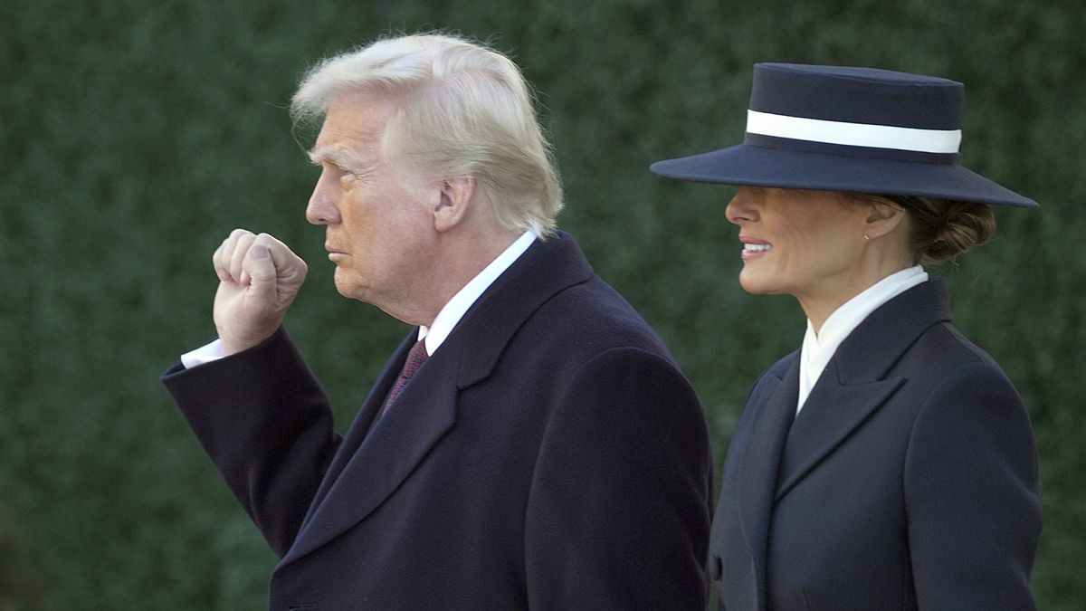 President-elect Donald Trump gestures as he walks with his wife Melania after a church service across from the White House in Washington, 20 January 2025