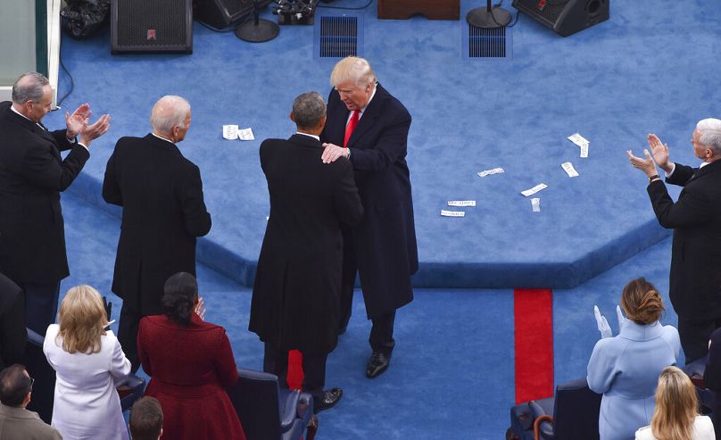 Trump greets former President Barack Obama following Trump's inaugural address during the Inauguration on Capitol Hill in Washington, Friday, Jan. 20, 2017