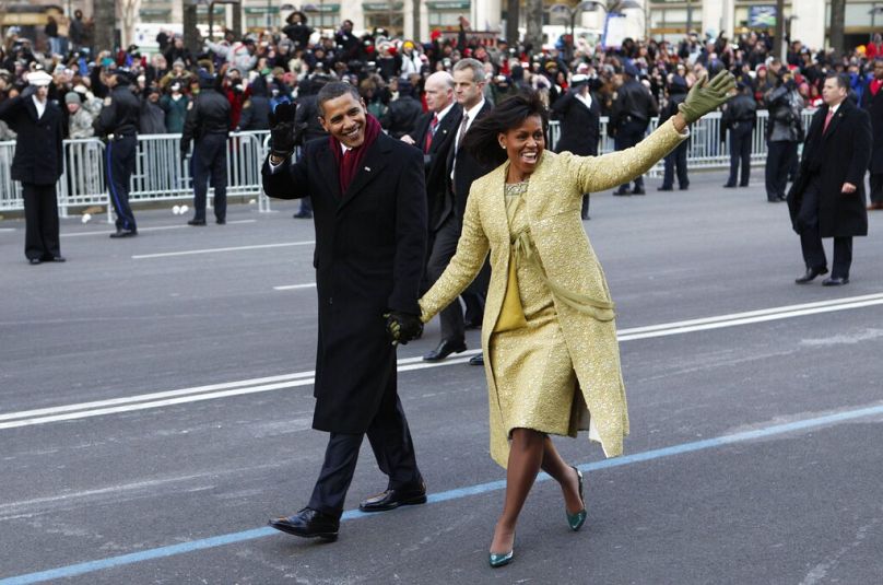 Barack Obama and first lady Michelle Obama walk the inaugural parade route in Washington, Jan. 20, 2009