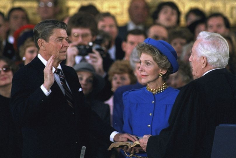 FILE - First lady Nancy Reagan, center, looks on as President Ronald Reagan is sworn in during ceremonies in the Rotunda beneath the Capitol Dome in Washington, Jan. 21, 1985