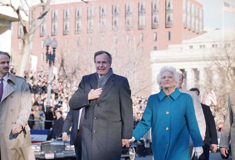 George H.W. Bush and his wife Barbara walk to the inaugural parade reviewing stand at the White House in Washington, Jan. 21, 1989