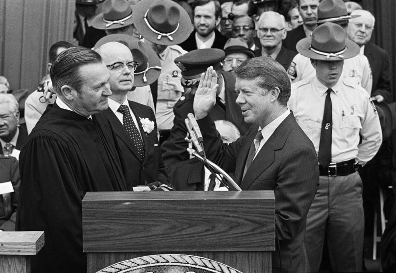 FILE - Judge Robert H. Jordan administers the oath of office to Gov. Jimmy Carter at the Georgia Capitol in Atlanta, Jan. 12, 1971