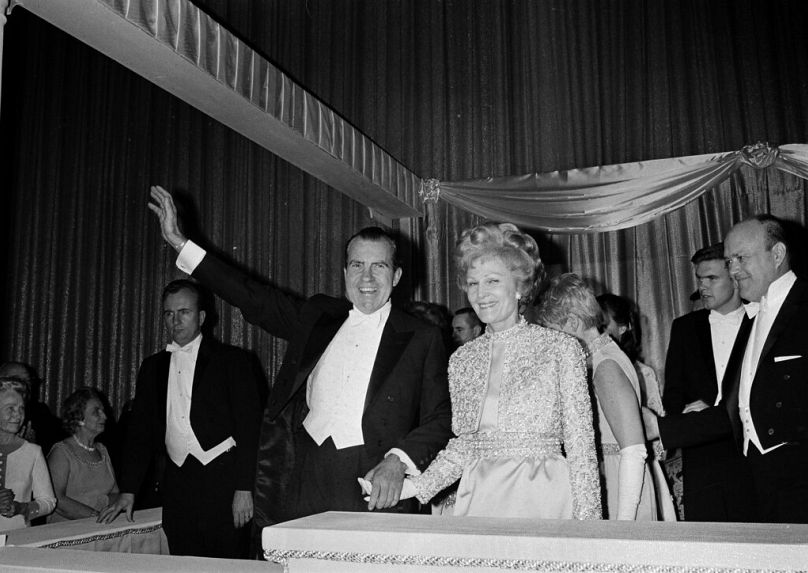 President Nixon and his wife Pat hold hands as they greet at the Shoreham Hotel Inaugural Ball in Washington, D.C., Jan. 20, 1969