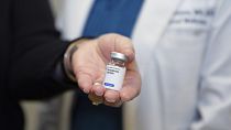 A patient holds her weight loss medication at a clinic in the US in December 2024.