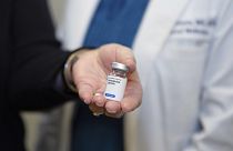 A patient holds her weight loss medication at a clinic in the US in December 2024.