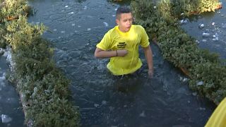 For Epiphany, a young boy enters the icy waters of the lake to accept the holy faith of the baptism of Jesus Christ, in Prilep in Northern Macedonia, 19.01.2025
