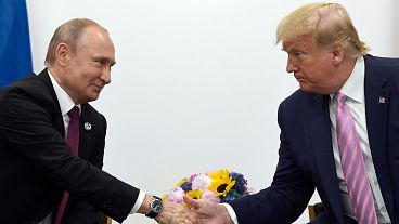 FILE - In this June 28, 2019, file photo, President Donald Trump, right, shakes hands with Russian President Vladimir Putin, left, during a bilateral meeting on the sidelines FILE - In this June 28, 2019, file photo, President Donald Trump, right, shakes hands with Russian President Vladimir Putin, left, during a bilateral meeting on the sidelines
