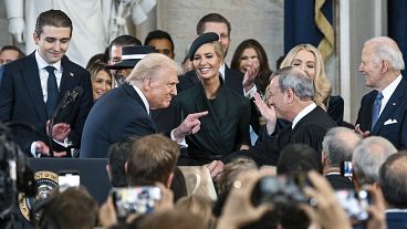 President Donald Trump points to Supreme Court Chief Justice John Roberts