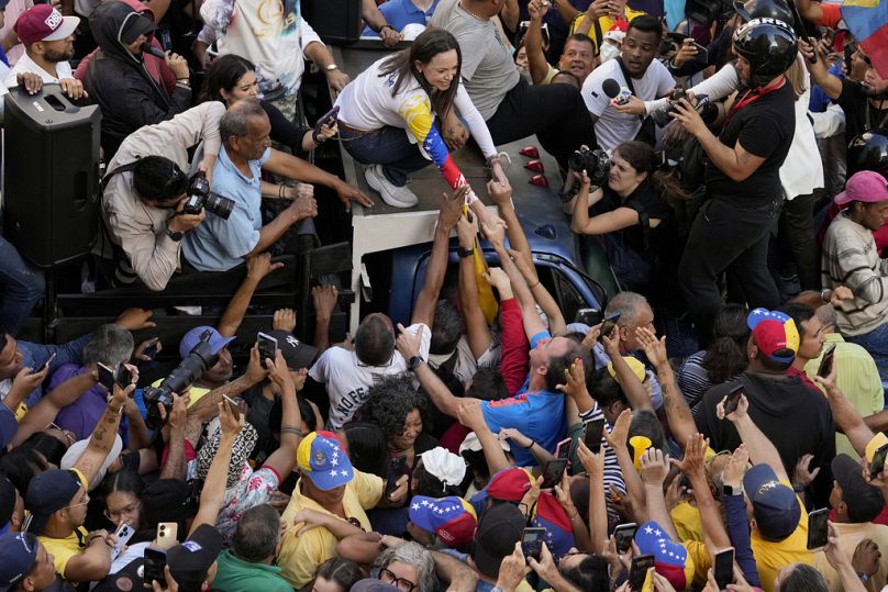 Venezuelan opposition leader Maria Corina Machado greets supporters at a protest against President Nicolas Maduro in Caracas, Venezuela, Thursday, Jan. 9, 2025