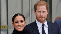 Meghan Markle and Prince Harry pose for pictures after visiting the observatory in One World Trade in New York, Sept. 23, 2021.