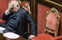 Justice Minister Carlo Nordio  puts his hand to his head during the presentation of the report on the justice administration, at the Senate, in Rome, Wednesday, Jan. 22, 2025