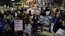 People hold signs during a rally against President Donald Trump's immigration policy, in Las Vegas, USA, 21.01.2025