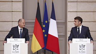 French President Emmanuel Macron, right, and German Chancellor Olaf Scholz give a joint statement at the Elysee Palace in Paris, Wednesday, Jan. 22 2025