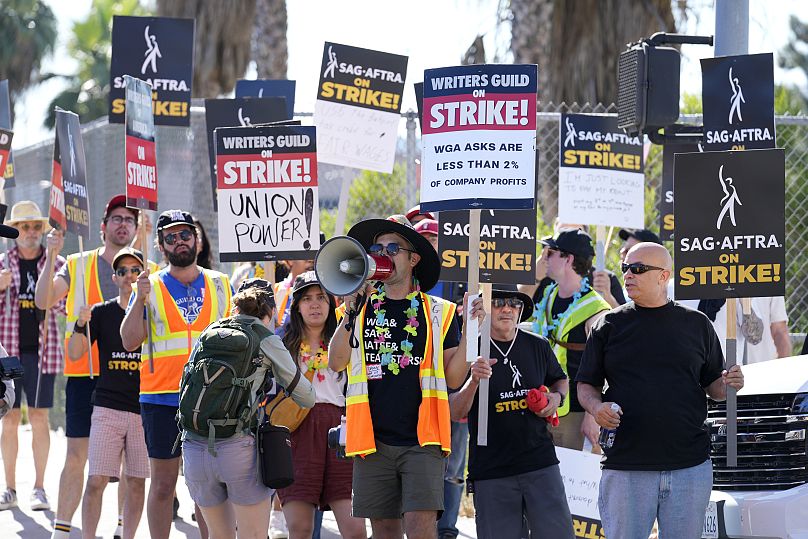 Striking writers and actors take part in a rally outside Netflix studio in Los Angeles on Friday, July 14, 2023. 