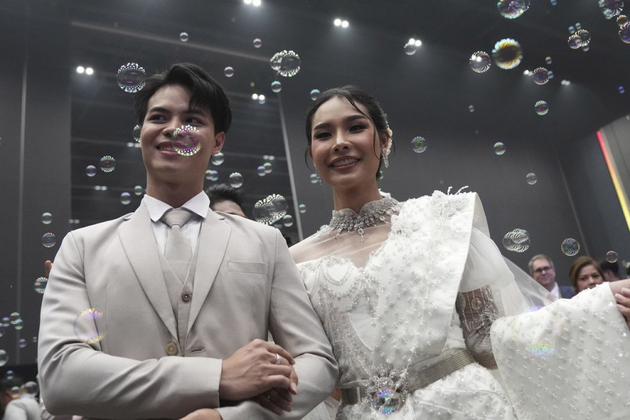 A couple from the LGBTQ+ community parade to a hall after the Marriage Equality Act took effect in Bangkok, Thailand, Thursday, Jan. 23, 2025.