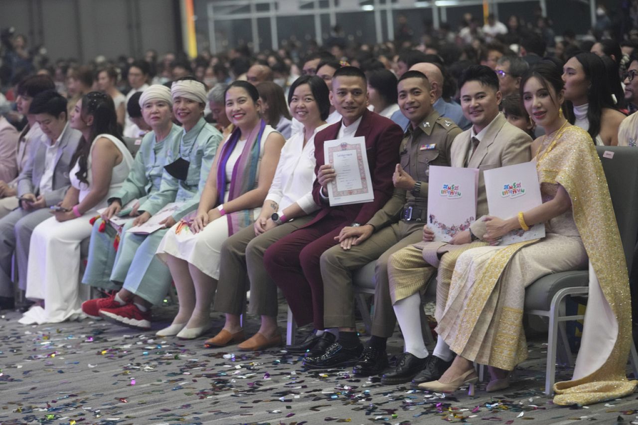 Couples from the LGBTQ+ community wait to sign their marriage certificates as the Marriage Equality Act takes effect