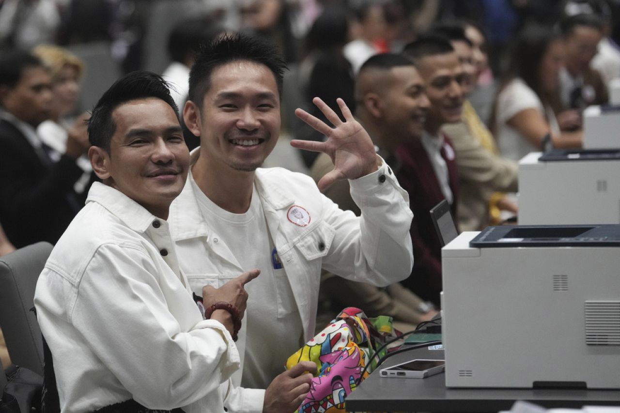 A couple from the LGBTQ+ community wait to sign their marriage certificates as the Marriage Equality Act takes effect