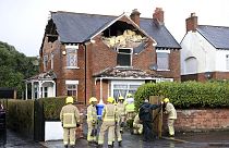 Firefighters secure a house damaged by the winds of storm Eowyn which hit the country in Belfast, Northern Ireland, 24.01.2025