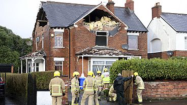 Firefighters secure a house damaged by the winds of storm Eowyn which hit the country in Belfast, Northern Ireland, 24.01.2025