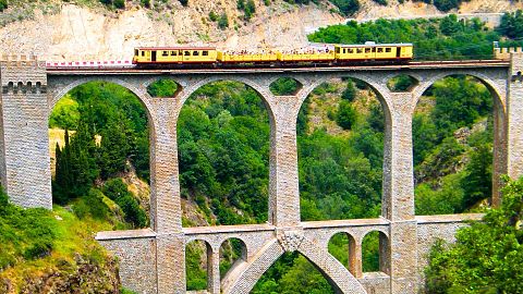 Running between Villefranche-de-Conflent and Latour-de-Carol in the Catalan region, France’s Le Petit Train Jaune offers a Wes Anderson style journey