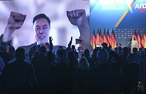 Elon Musk is shown during a live video link at an ADF event in Halle, Germany. 25 Jan 2025.