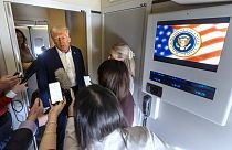 President Donald Trump speaks to reporters aboard Air Force One as he travels from Las Vegas to Miami on Saturday, Jan. 25, 2025. (AP Photo/Mark Schiefelbein)