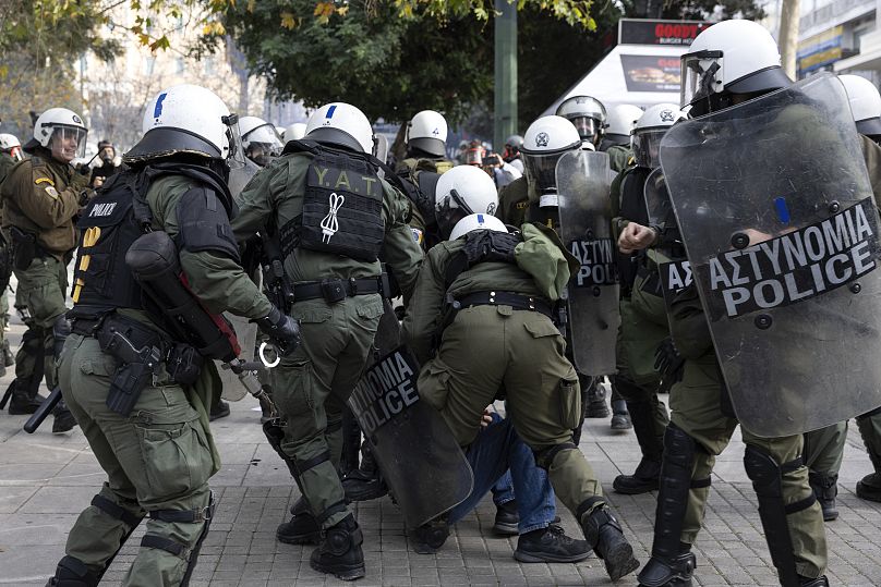 Police detain a protester during a rally organised by the association of the families of victims of the Tempi train collision in Athens, January 26, 2025