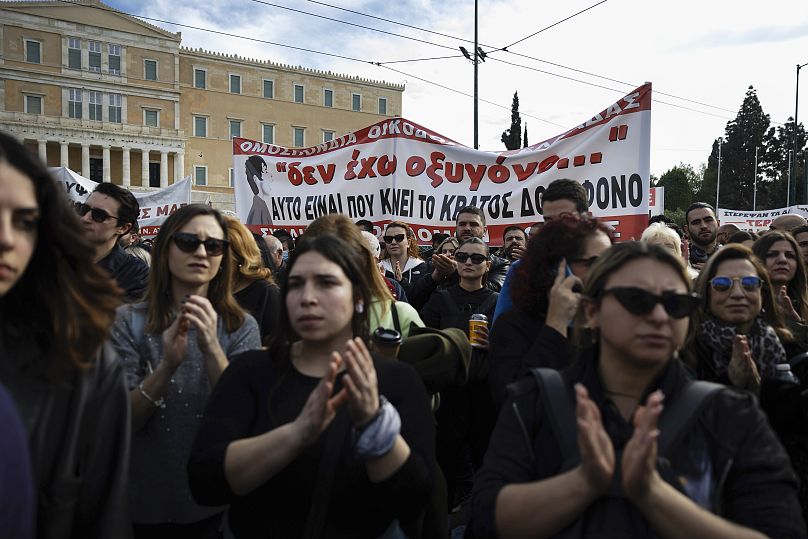 Protesters hold a banner reading 'I Have No Oxygen' at a rally in Athens, 26 January, 2025