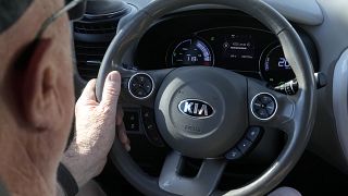 A Kia electric vehicle is driven
