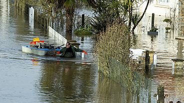 A resident and his small boat after storm Herminia unleashed torrential rain on the region, village of Guipry Messac in France, 27.01.2025