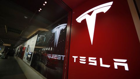 A sign bearing the company logo outside a Tesla store in Cherry Creek Mall in Denver is seen here on Feb. 9, 2019. 