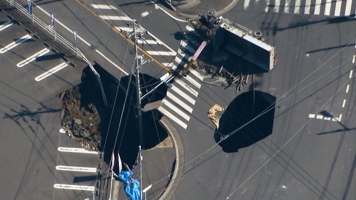 Video. Truck swallowed by sinkhole in Japan, with rescue efforts complicated by second hole