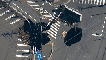 Rescue efforts stalled as second cavity emerges a day after sinkhole traps truck driver
