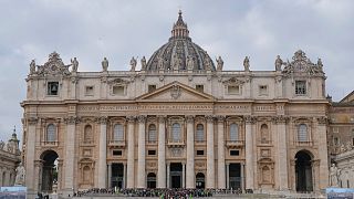 Faithful leave St. Peter's Basilica at the end of a mass presided by Pope Francis at the Vatican, Sunday, Jan. 26, 2025.