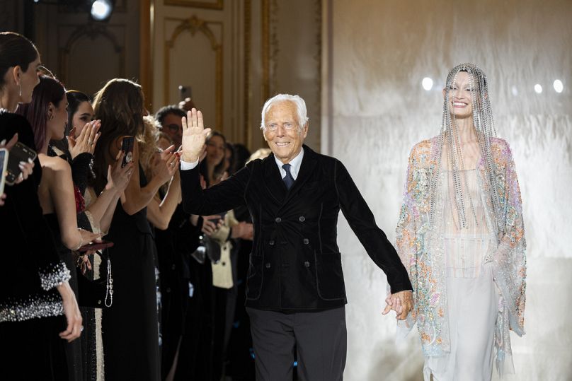 Giorgio Armani accepts applause at the end of the Giorgio Armani Prive Haute Couture Spring Summer 2025 collection in Paris. 