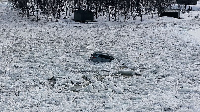 A car stuck in a slush flow. 