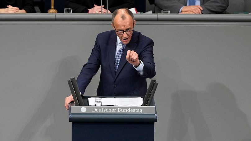 German opposition leader Friedrich Merz speaks at a debate about migration at the German parliament Bundestag in Berlin.