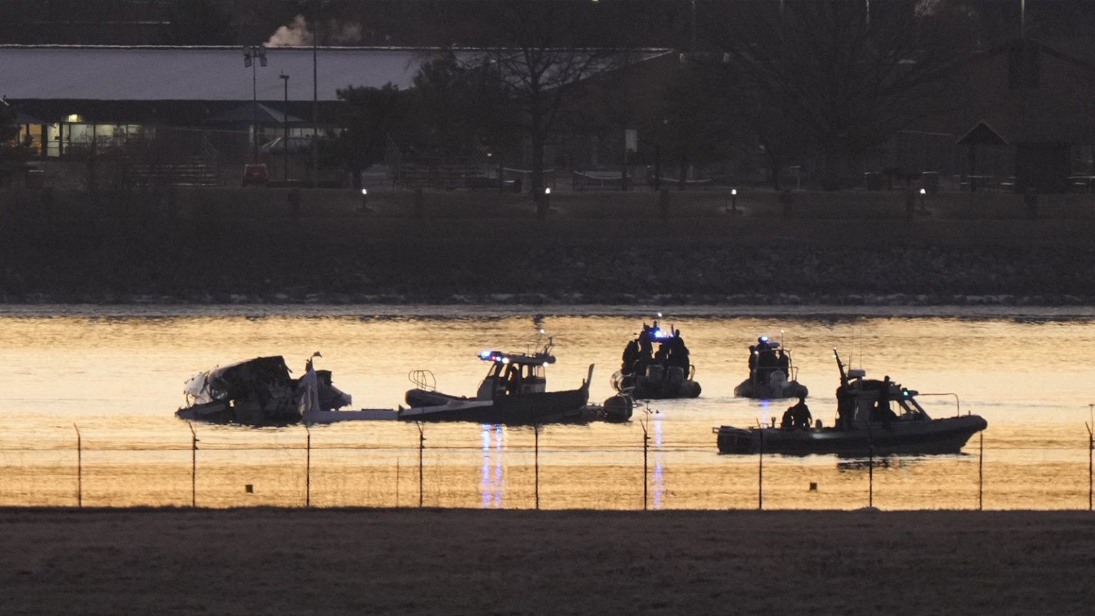 Search and rescue efforts are seen around a wreckage site in the Potomac River from Ronald Reagan Washington National Airport, 30 January 2025
