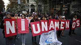 FILE: Demonstrators hold placards with a phrase that reads in English "not even one less" during a march against domestic violence Buenos Aires, Argentina, June 3, 2016 