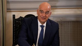 Greece's Defense Minister Nikos Dendias smiles before a press conference, Thursday, July 6, 2023.