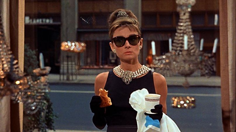 Audrey Hepburn enjoys a croissant in 'Breakfast at Tiffany's' 