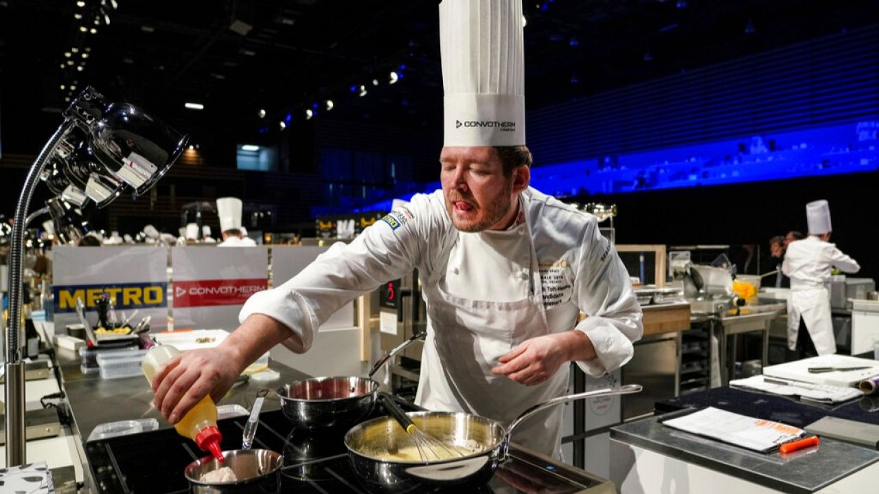 Danish chef Kenneth Toft-Hansen prepares food during the 2019 final of the Bocuse d'Or