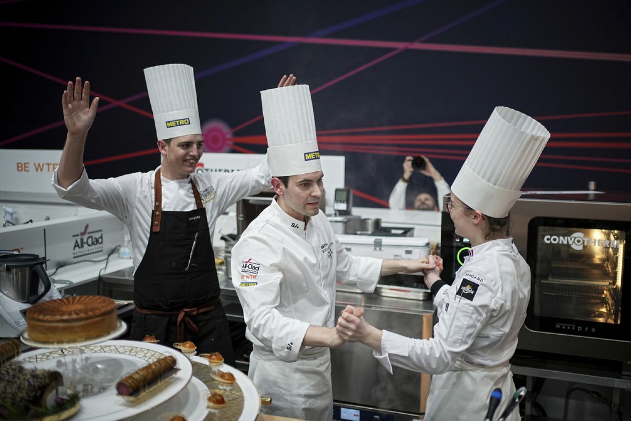 French chef Paul Marcon celebrates with his teammates at the end of the Bocuse d'Or final